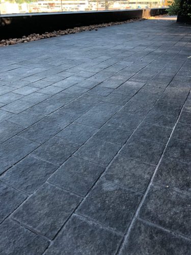 hsn-black-basalt-flamed-outdoor-paving-installed-angle