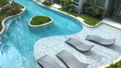 Sanded Tribeca limestone used on a swimming pool with top view from above